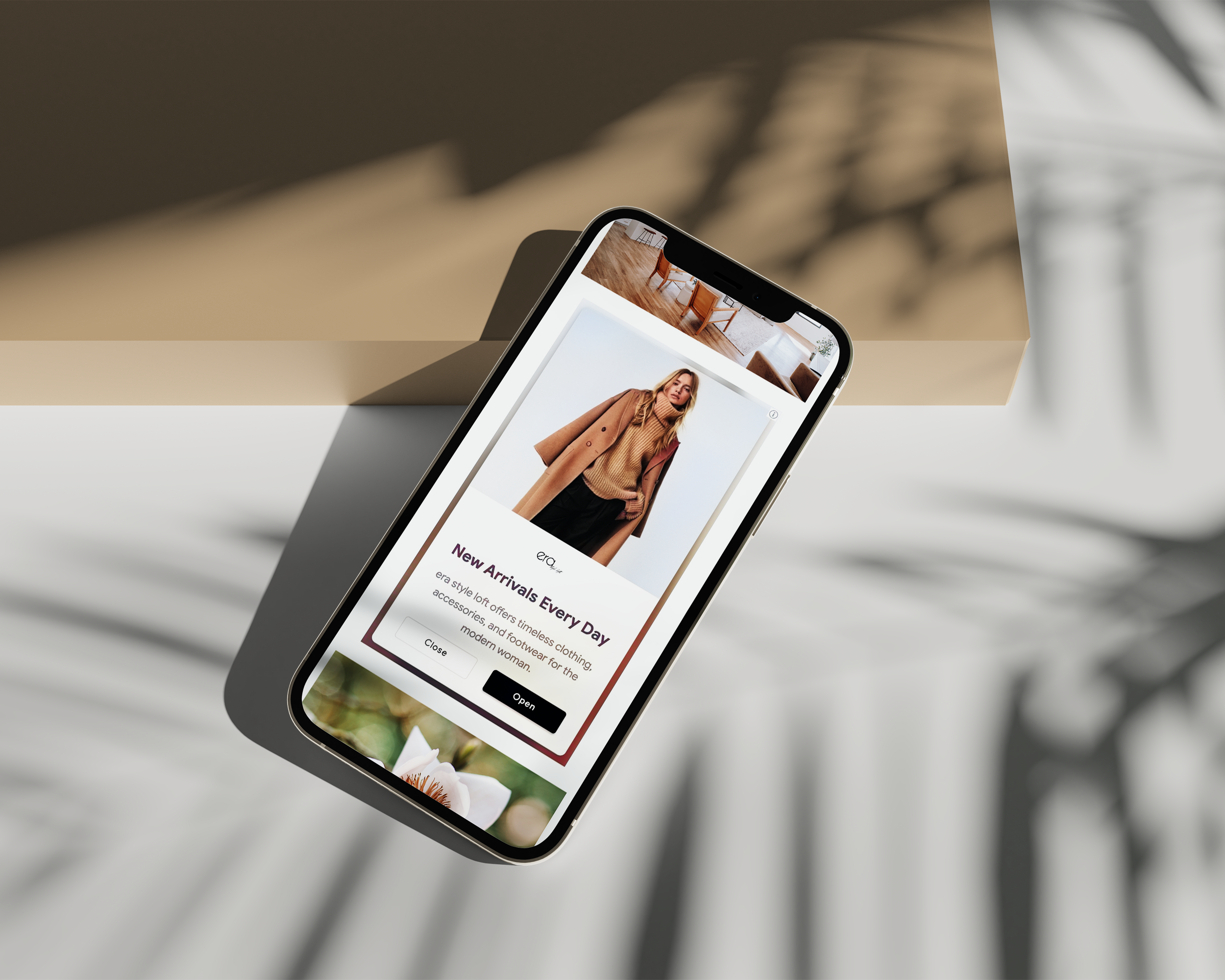 smartphone showing Era Style Loft digital ads