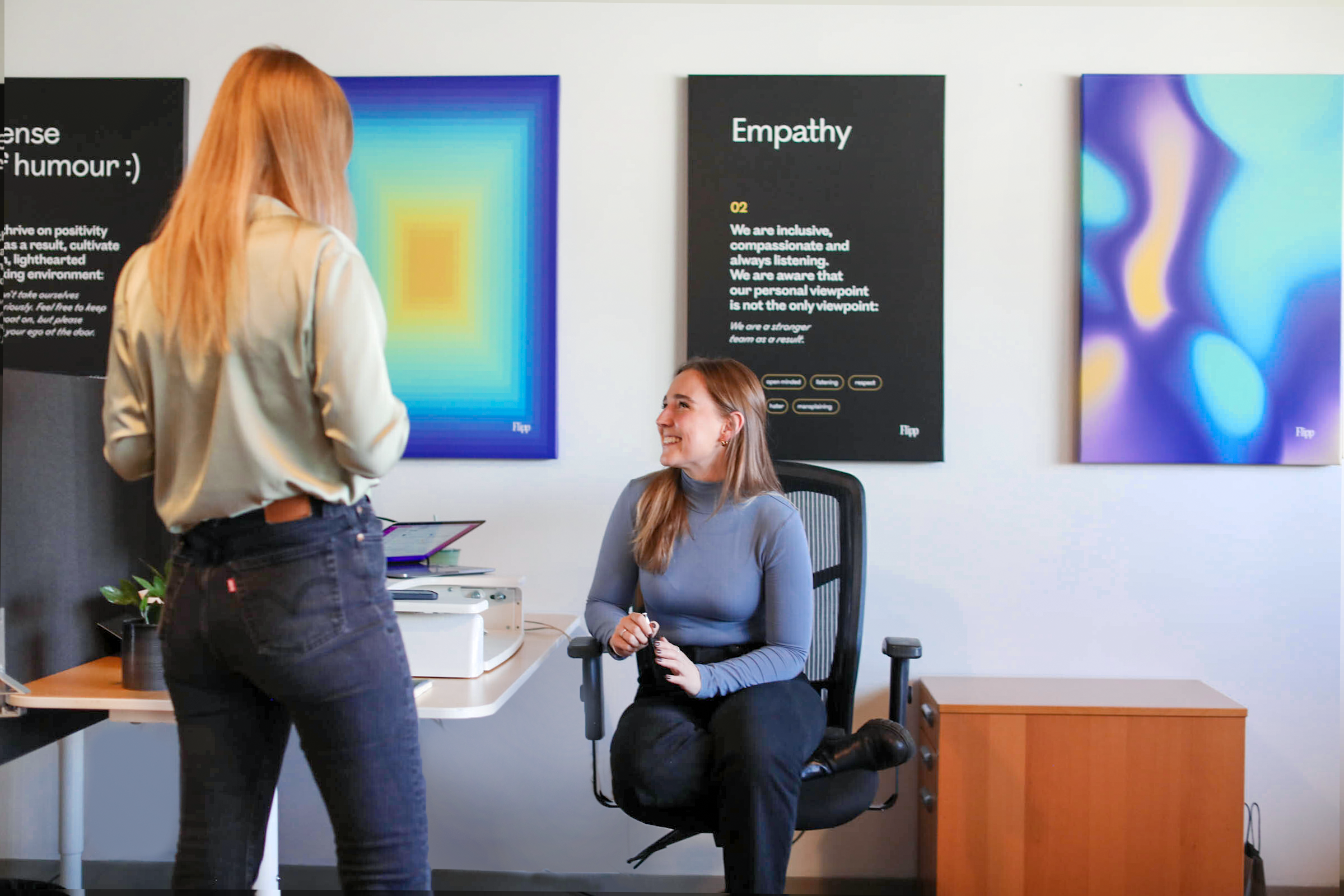 coworkers interacting in an office setting