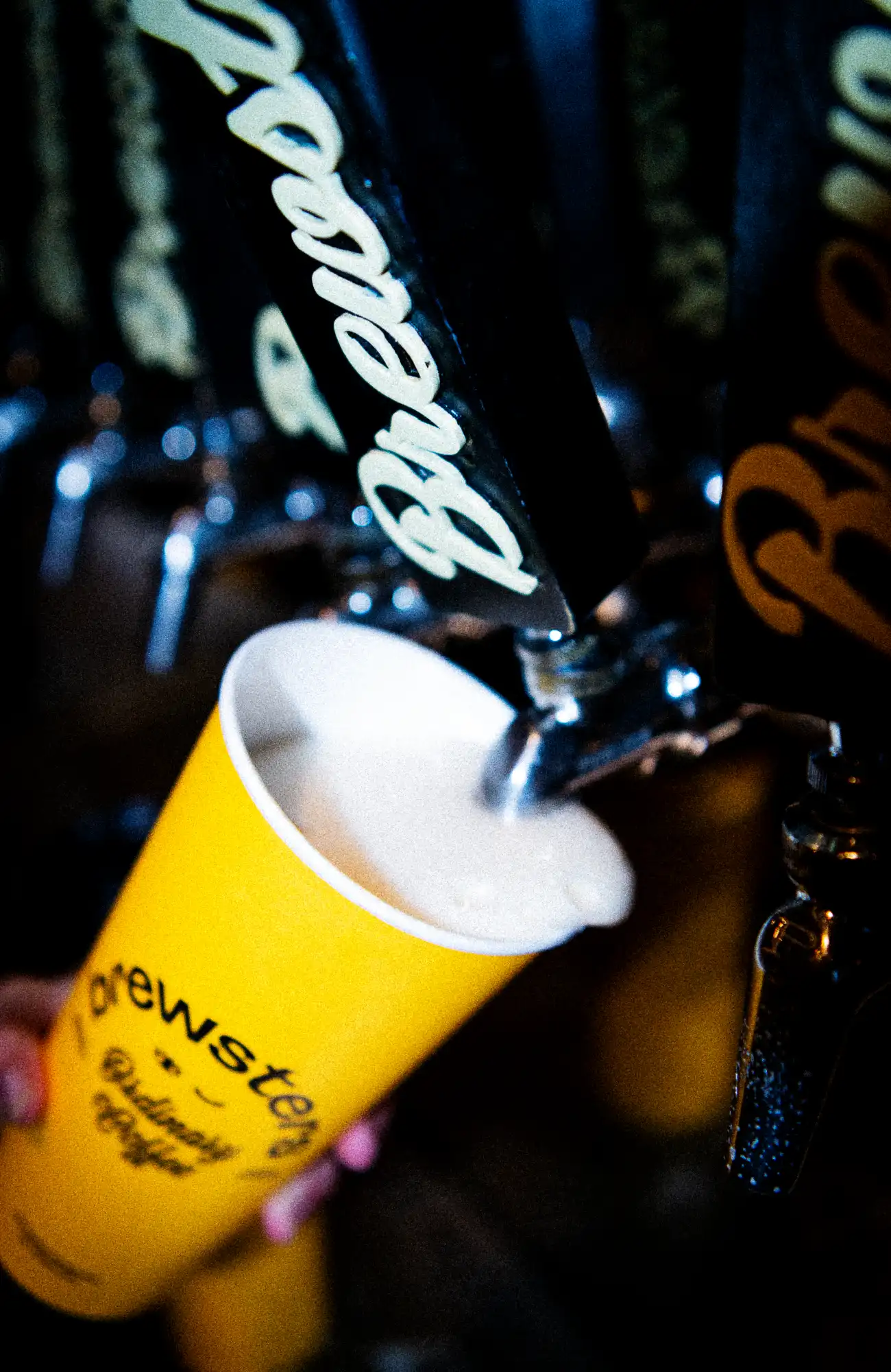 Beer being poured into a Brewsters cup