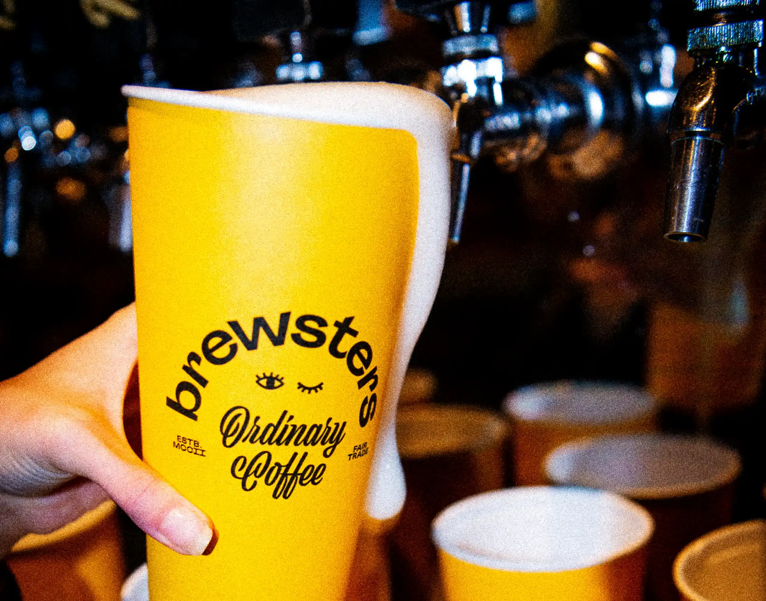 Brewsters beer being poured into to-go cup