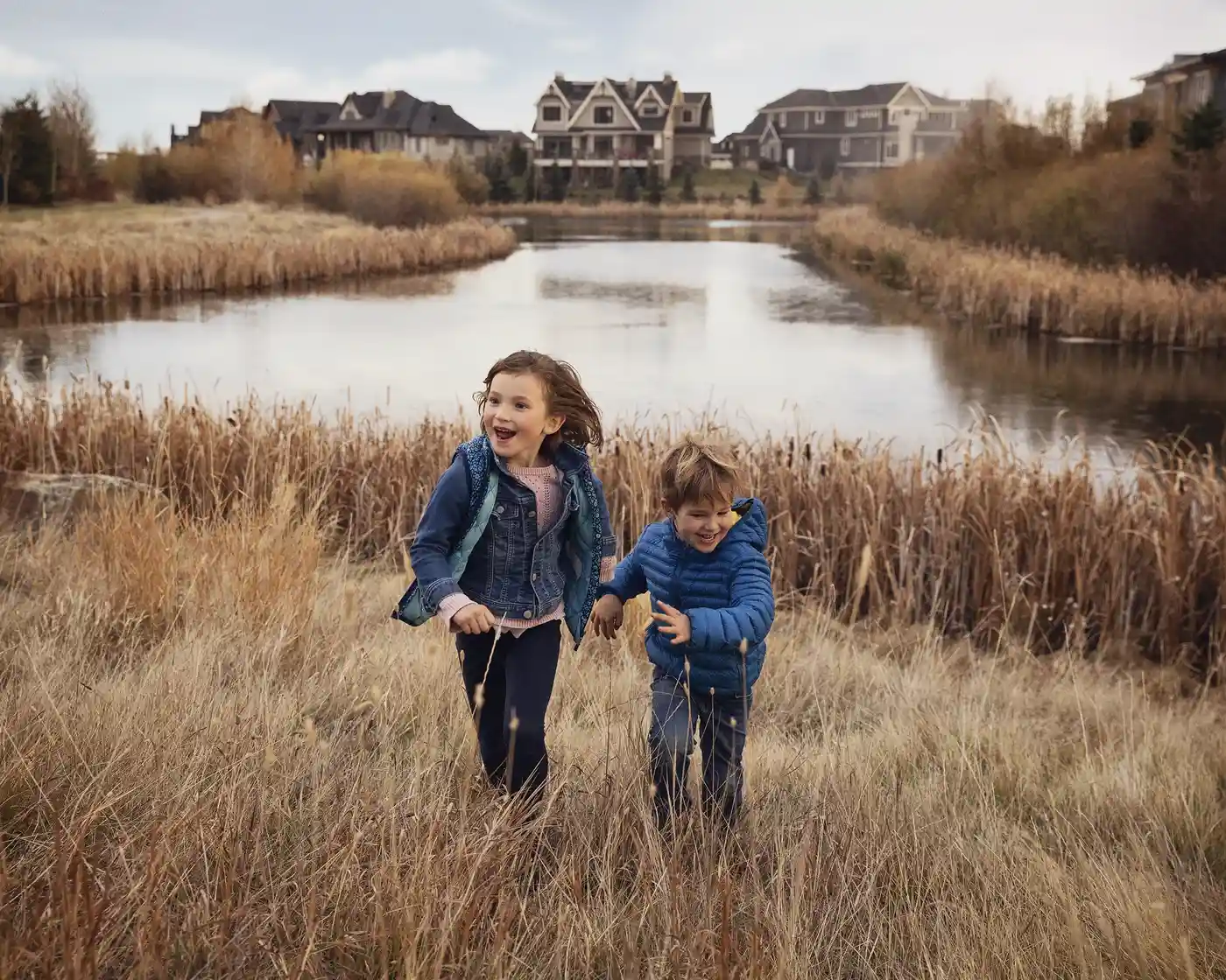 kids running through grass in Watermark
