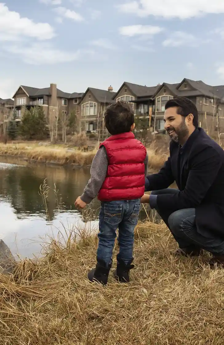 father and son by pond